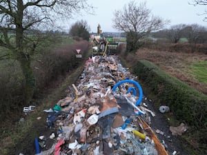 Fly-tipped waste being removed from Watery Lane near Lichfield