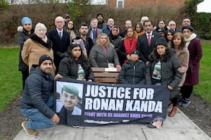 Family and friends gathered at a bench at Hill Avenue playground in Lanesfield in memory of 
murdered Ronan Kanda