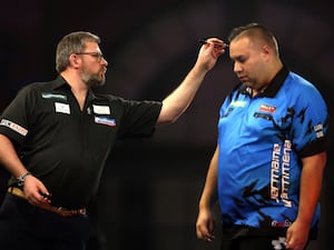 James Wade (left) and Jermaine Wattimena during the World Darts Championship