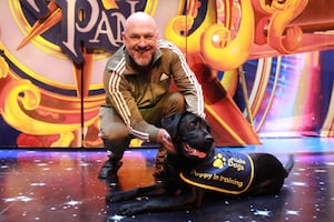 Matt Slack with a guide dog puppy. 