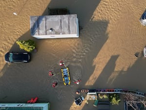 A rescue boat in a flooded area seen from above