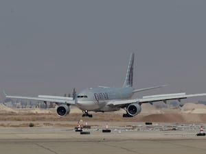 A Qatar Airways plane, a first international commercial flight since the fall of former Syrian president Bashar Assad, lands at Damascus international airport arriving from Qatar