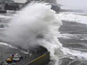 A large wave breaking on a sea wall