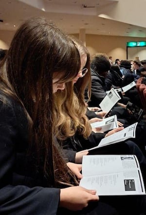 Wolgarston Students pictured reading along as performances took place on stage