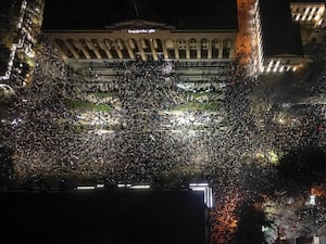 Demonstrators rally outside the Georgian parliament’s building in Tbilisi to protest the government’s decision to suspend negotiations on joining the European Union for four years