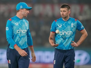 Mark Wood, right, chats with England captain Jos Buttler during the second ODI against India