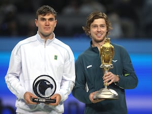 Winner Andrey Rublev (right) and runner-up Jack Draper pose with their trophies after the final of the Qatar ExxonMobil Open