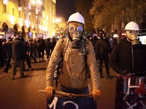 Demonstrators wearing gas masks in Tbilisi