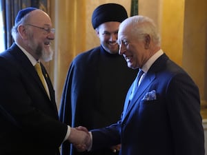 The King (right) meets with Chief Imam Dr Sayed Razawi and Chief Rabbi Sir Ephraim Mirvis (left) at Buckingham Palace, London.