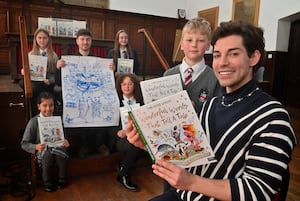 Tom Read Wilson and his Illustrator: Ian Morris were there to talk about there new book, to an audience of pupils from a number of different schools.  Front is Tom and Grammar Schools: Kit Baldwin 9, At the back are pupils: Jasmine Midha 8,  and Lola Moore 13 from the Grammar School, and Gabija Santaraite 10 from Bantock Primary School and Anais Broadhurst 11 from Perton Middle School.