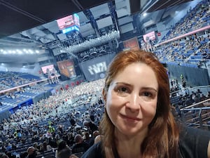 Woman taking a selfie at a concert