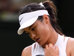 Emma Raducanu looks down during a match