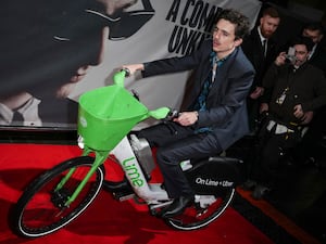 Timothee Chalamet on a Lime bike in London