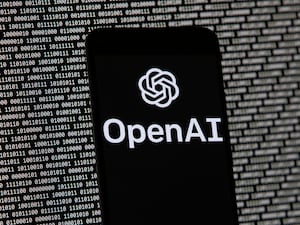 The OpenAI logo appears on a mobile phone