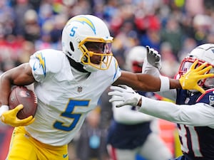 Los Angeles Chargers wide receiver Joshua Palmer (5) pushes away New England Patriots cornerback Jonathan Jones