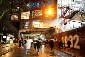 Aston Villa fans make their way to Villa Park.