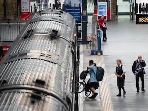 Passengers board a train