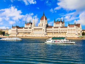 Boats on the river next to the parliament building in Budapest, Hungary