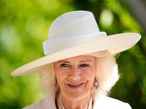 Camilla in a white hat