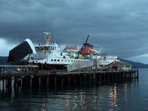 Ferry docked amid grey skies