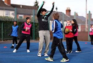 Sam Johnstone and Rodrigo Gomes of Wolverhampton Wanderers visit Bantock Primary School on October 22, 2024 in Wolverhampton. (Photo by Jack Thomas - WWFC/Wolves via Getty Images)