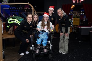 Wolves Women players meet one of the participants at the bowling event.