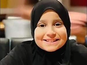 Head shot of a young girl wearing a hijab