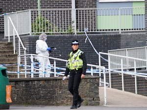 Police and forensic investigators at Amman Valley school, in Ammanford, Carmarthenshire