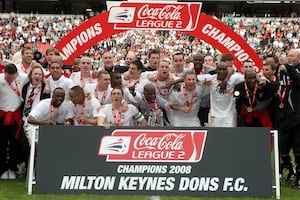 MK Dons celebrate after winning League Two under Paul Ince in 2008. (Image by Press Association)