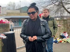 Caroline Willgoose leaving All Saints Catholic High School in Sheffield where her son Harvey was fatally stabbed on Monday (Sophie Robinson/PA)