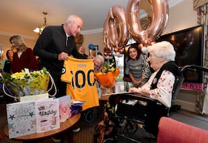 Joan was presented with a special jersey to commemorate the special occasion. 