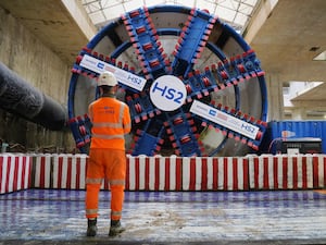 A HS2 worker stands in front of tunnel boring machine Karen at the Old Oak Common station site