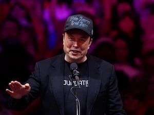 Elon Musk in a Maga hat