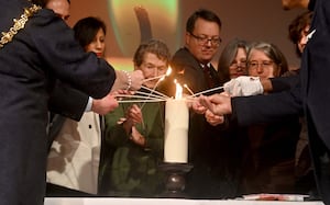 Guests at the event lit a symbolic candle