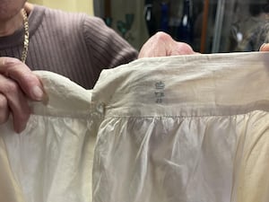 Hansons Auctioneers employees show the fastener of Queen Victoria's baggy bloomers