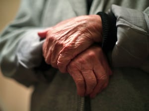 A-close-up of an elderly person's hands