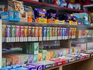 Disposable vapes for sale alongside gum and sweets