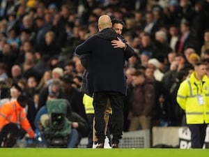 Manchester United manager Ruben Amorim embraces Manchester City manager Pep Guardiola