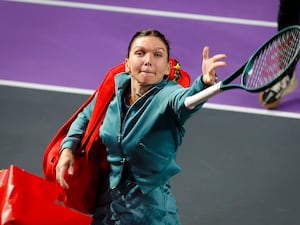 Simona Halep throws her racket into the crowd