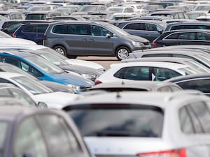 Used cars parked alongside one another