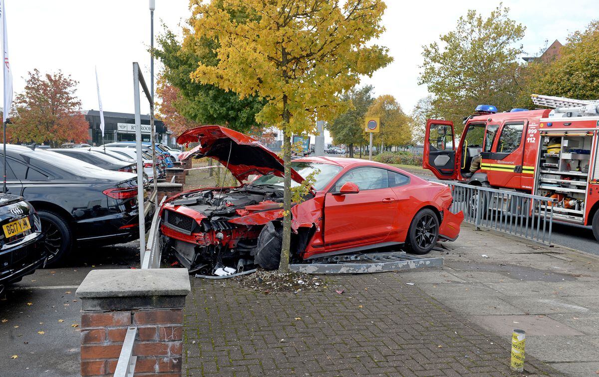 Car crashes onto pavement next to Audi garage in Wolverhampton