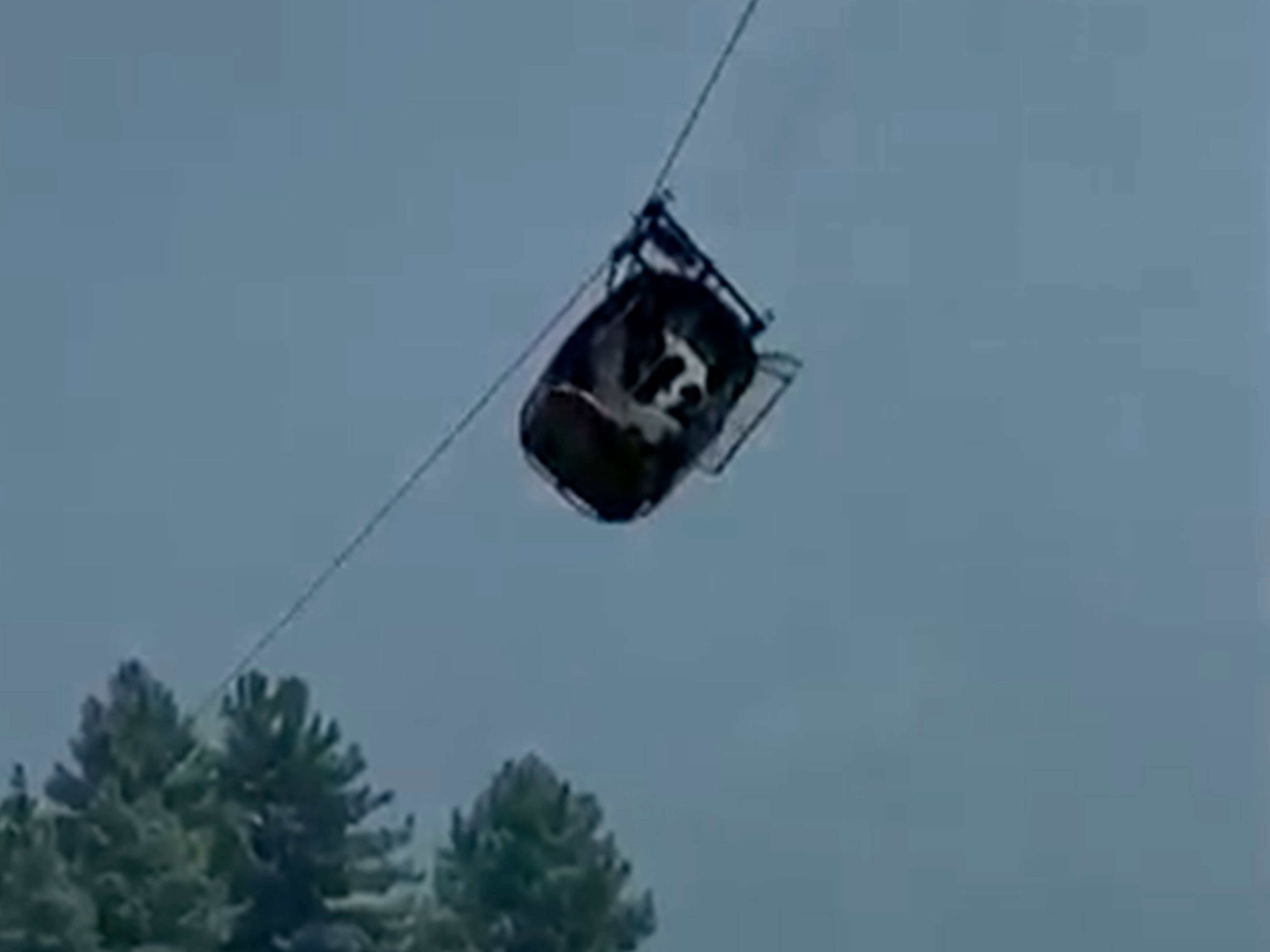 Rescuers save eight people trapped in cable car above canyon in Pakistan