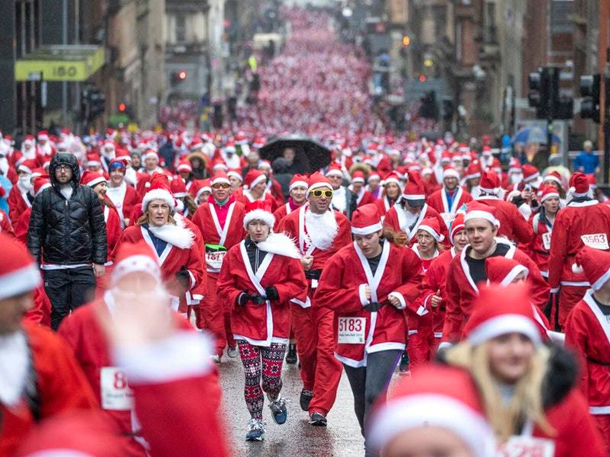 In Pictures Dashing through the streets as Santas run for charity