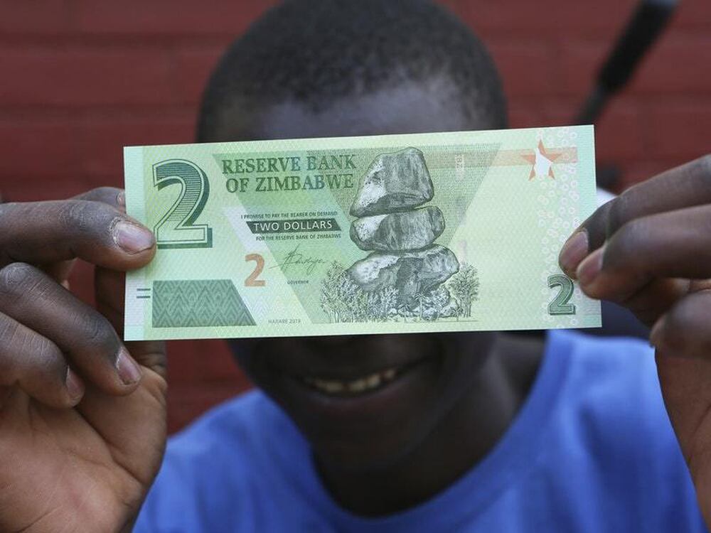 Zimbabwe begins issuing new banknotes to help ease cash crunch