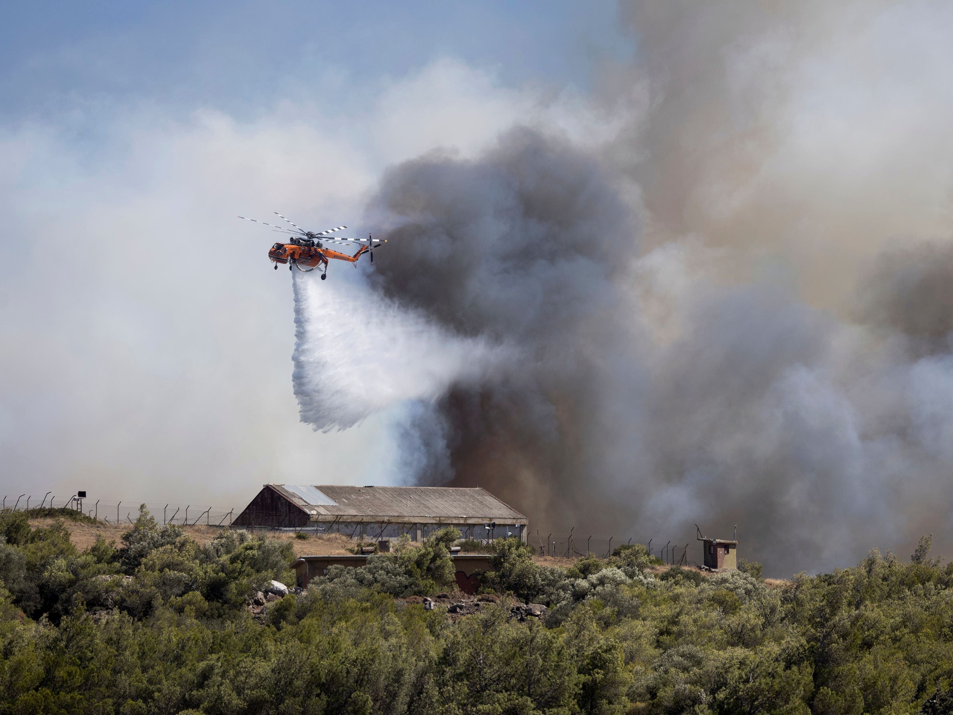 Firefighters tackle blazes on Greek islands of Chios and Kos